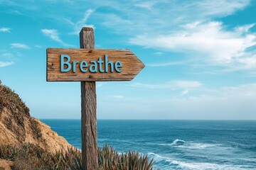 Scenic Ocean View with Wooden Sign Reading 'Breathe' in Soft Pastel Colors Evokes Calm and Serenity by the Coastline and Seaside Cliffs