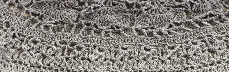 background of gradient gray crochet ornament made of wool