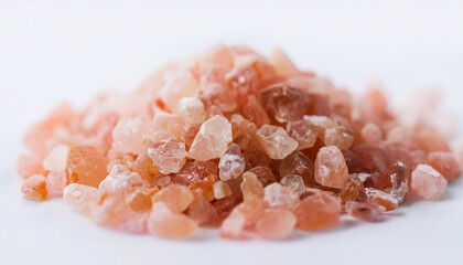 Heap of crystals Himalayan salt. Natural mineral. Isolated on white backdrop. Close-up.