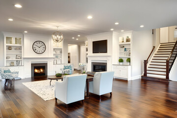 Fototapeta premium Modern living room with a fireplace, comfortable seating, and stylish decor.