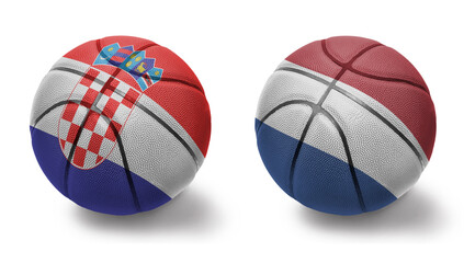 basketball balls with the national flags of netherlands and croatia on the white background.