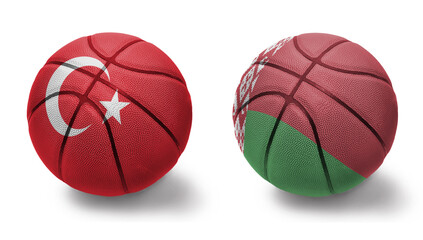 basketball balls with the national flags of belarus and turkey on the white background.