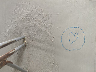 Crayon scribbles in the shape of love on a wall