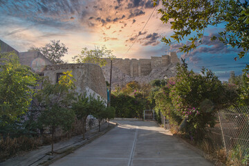 View of the  Acropolis surrounded by ancient architecture in Athens, Greece during a clear day