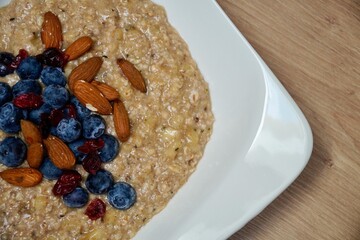 Healthy breakfast. Oatmeal with blueberries and almond
