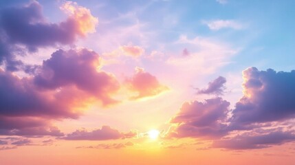 Obraz premium A breathtaking sunset with vibrant pink and orange hues illuminating the clouds in a serene sky.