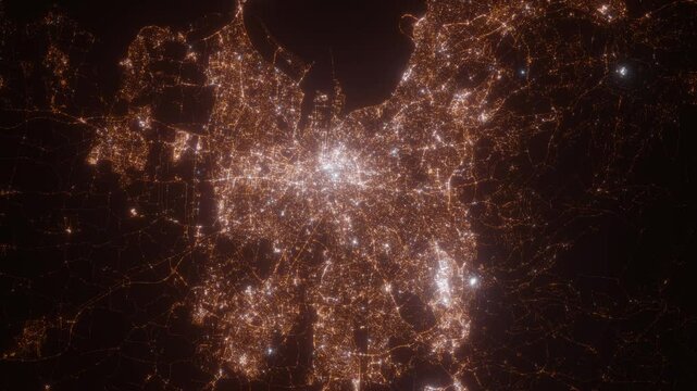 Dublin (Ireland) aerial view at night. Top view on modern city with street lights. Camera is zooming out, rotating counterclockwise. Vertical video. The north is on the left side
