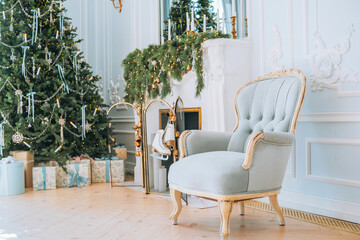 Cozy holiday setting with elegant chair and decorated Christmas tree