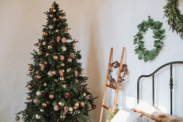 Festively decorated Christmas tree in cozy indoor setting during holiday season