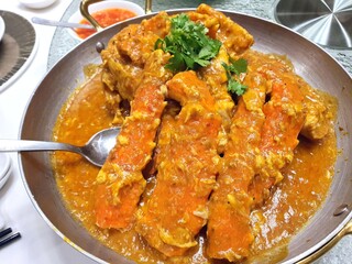 Popular Chilli crab of Singapore .Chilli crab is a seafood dish in which stir-fried crab is coated with sweet, savoury, and spicy tomato-based sauce.