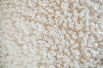 Textured white fabric with fluffy fibers on display in natural light