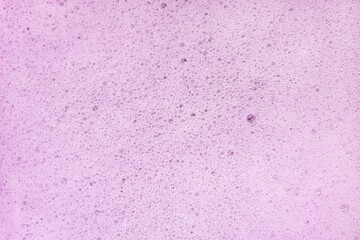 Pink soap foam texture with small  soap bubbles