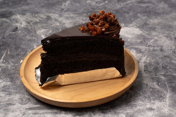 chocolate cake on plate. decorated with chocolate,cake has three layers