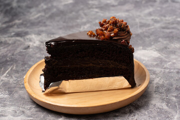 chocolate cake on plate. decorated with chocolate,cake has three layers