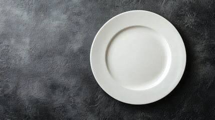A white plate on a green background.