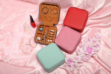 Diffirent colors leather jewelry box. Concept shot, top view. Custom background jewelry box view. Jewelry box and accessories. Pink background.