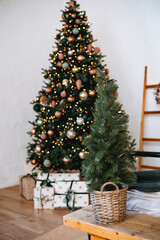 A cozy living room decorated for Christmas with a beautiful tree and gifts