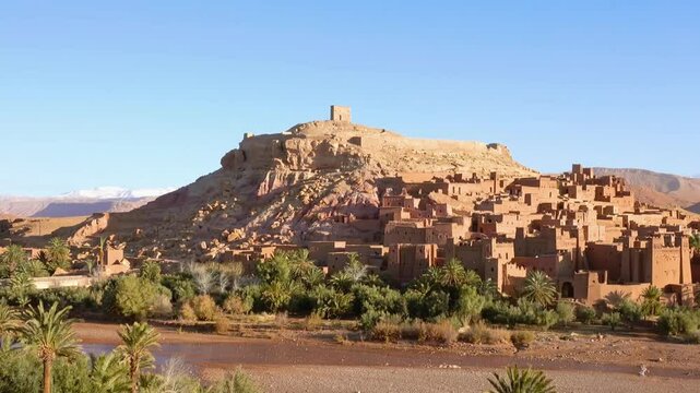 Kasbah Of Ait Benhaddou a group of earthen buildings surrounded by high walls, is a traditional pre-Saharan habitat. The houses crowd together within the defensive walls, which are reinforce