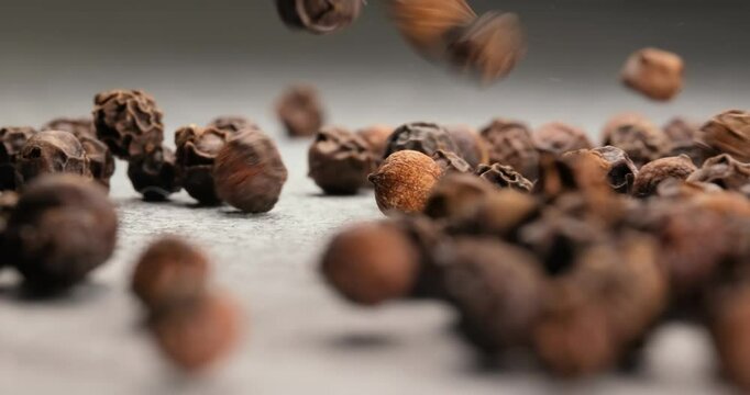 Peppercorns or black pepper spice. Super Macro Close Up.