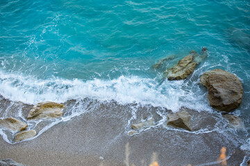 Aerial view of virgin hidden beach in greek island Lefkada, blue turquiose water waves