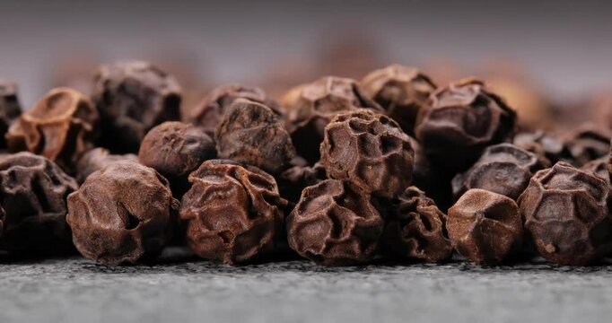 Peppercorns or black pepper spice. Super Macro Close Up.