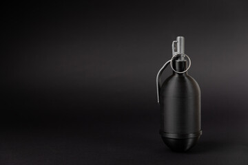 Hand grenade on textured background. Close-up. Weapons of war. Fragmentation grenade detail....