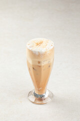 Glass of sweet iced coffee shake with milk