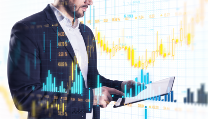 Businessperson using a tablet with financial data charts and stock market graphs overlaid. White background. Concept of technology and finance. 3D Rendering