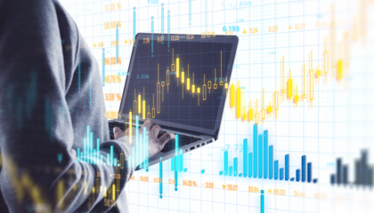 A person using a laptop with financial stock market data displayed on the screen, with graph charts overlayed, on a light background. Business concept. 3D Rendering.
