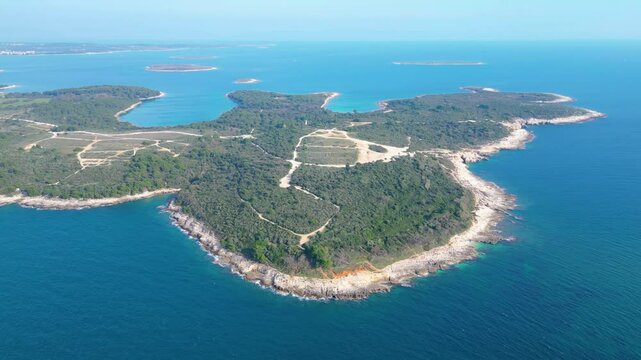 Rt Kamenjak is a stunning peninsula located near Pula, Croatia. Renowned for its rugged coastline, crystal-clear waters, and numerous small islands, it offers breathtaking aerial views