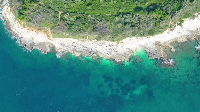 Rt Kamenjak is a stunning peninsula located near Pula, Croatia. Renowned for its rugged coastline, crystal-clear waters, and numerous small islands, it offers breathtaking aerial views