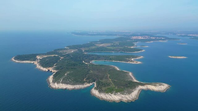 Rt Kamenjak is a stunning peninsula located near Pula, Croatia. Renowned for its rugged coastline, crystal-clear waters, and numerous small islands, it offers breathtaking aerial views