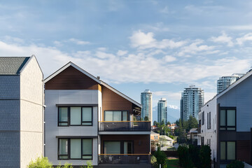 Obraz premium New Modern House Apartment Buildings in Vancouver BC. Canadian modern residential architecture on sunny summer day