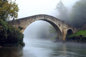 Fototapeta premium Bridges Over a Foggy River: A historic bridge arching over a slow-moving river