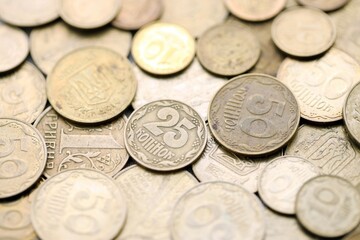 Big pile of different coins from various time period in Ukraine. Shiny Ukrainian money background