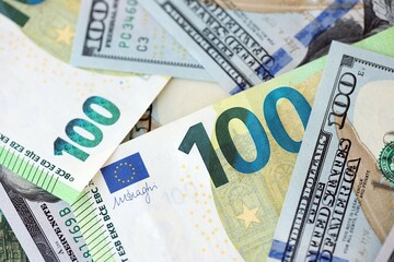 Big pile of Euro and USD banknotes. Many european and united states dollars