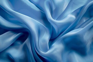 Fototapeta premium Blue silk fabric drapery material. Detailed photo textured background