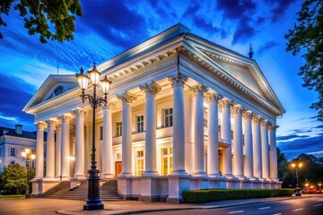 Obraz premium Night Photography of a Neoclassical White Building with Columns, Illuminated Facade, Architectural Details, Urban Scene, Classic Design, Beautiful Night Sky, Historic Architecture, City Landscape