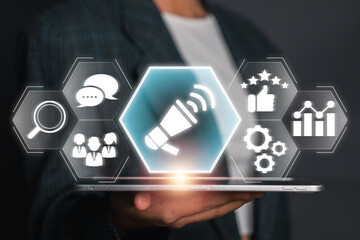 Digital advertising concept showcasing a megaphone and marketing icons on a virtual interface, symbolizing modern marketing strategies.