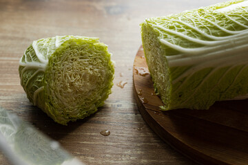  Chinese cabbage and knife on wooden table
