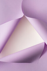 Bright violet folded paper creating frame layout. Minimal lilac background design.