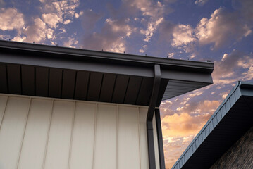 Brown square metal rain gutter system at sunset © Sergey