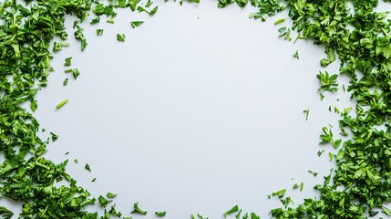 Fototapeta premium Chopped parsley arranged in a circular frame, on a white background with copy space in the middle for text