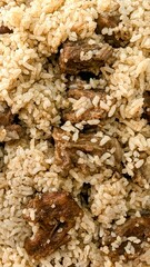 Traditional Bangladeshi biriyani served in a bowl with fragrant rice, tender marinated meat, and aromatic spices. A popular South Asian dish, rich in color and full of authentic flavors