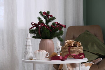 Create Cozy Holiday Decor with Lush Greenery and Soft Textures to Enhance Your Space