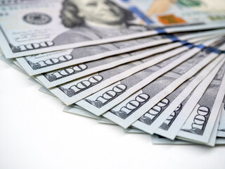 $100, Dollar banknotes background. Money fan, close-up one hundred numbers on dollar bill banknote, money cash isolated on white background.