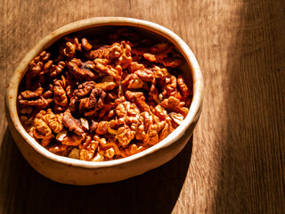 Peeled walnut lies in a bowl