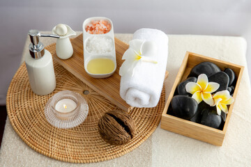 Exquisite display of beauty treatment and spa salon accessories arranged on spa table in luxury spa resort. Relaxing spa massage and recreation background concept. Quiescent