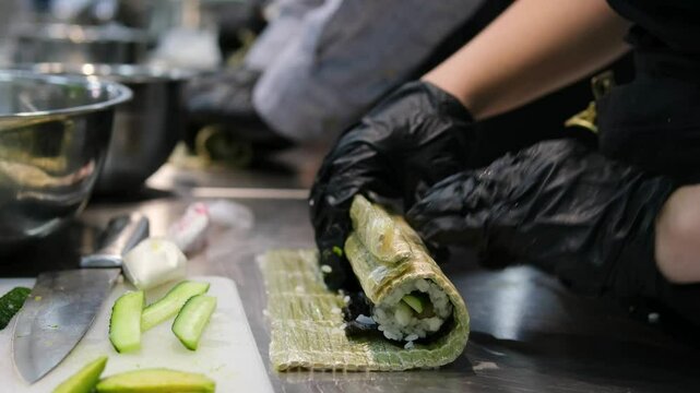 asian cuisine sushi cooking sushi at a culinary master class with a cheese cap use a torch sushi tempra baked rolls in batter and breadcrumbs with avocado the whole cooking process step by step