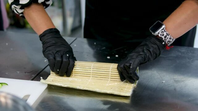 asian cuisine sushi cooking sushi at a culinary master class with a cheese cap use a torch sushi tempra baked rolls in batter and breadcrumbs with avocado the whole cooking process step by step